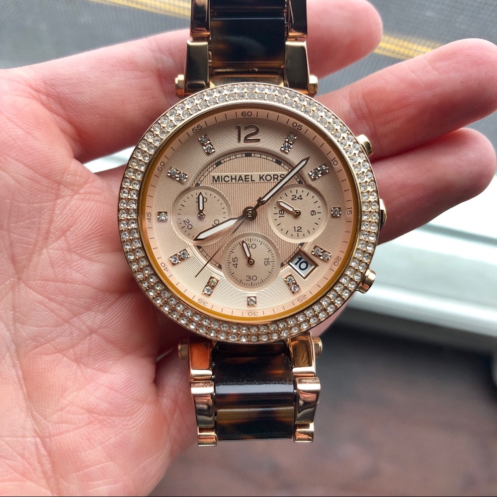 Women’s rose gold/tortoise Michael Kors watch